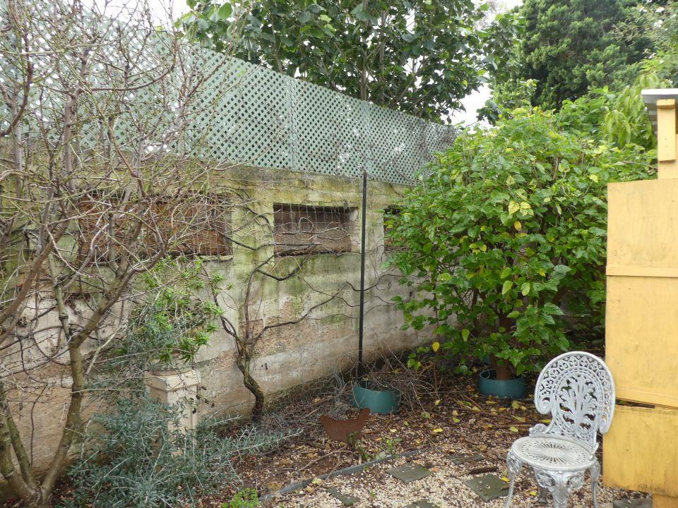 Existing masonry boundary wall inspected for stability and cracking